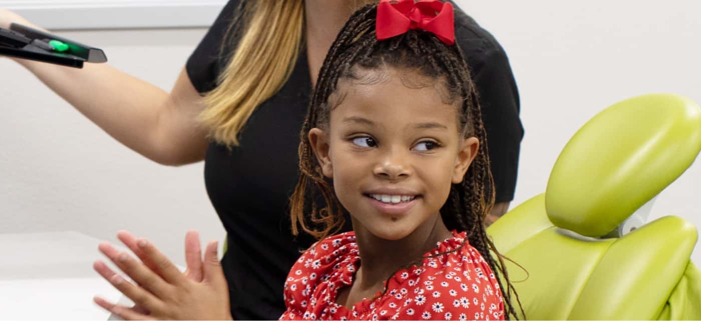 young girl smiling during dental appointment
